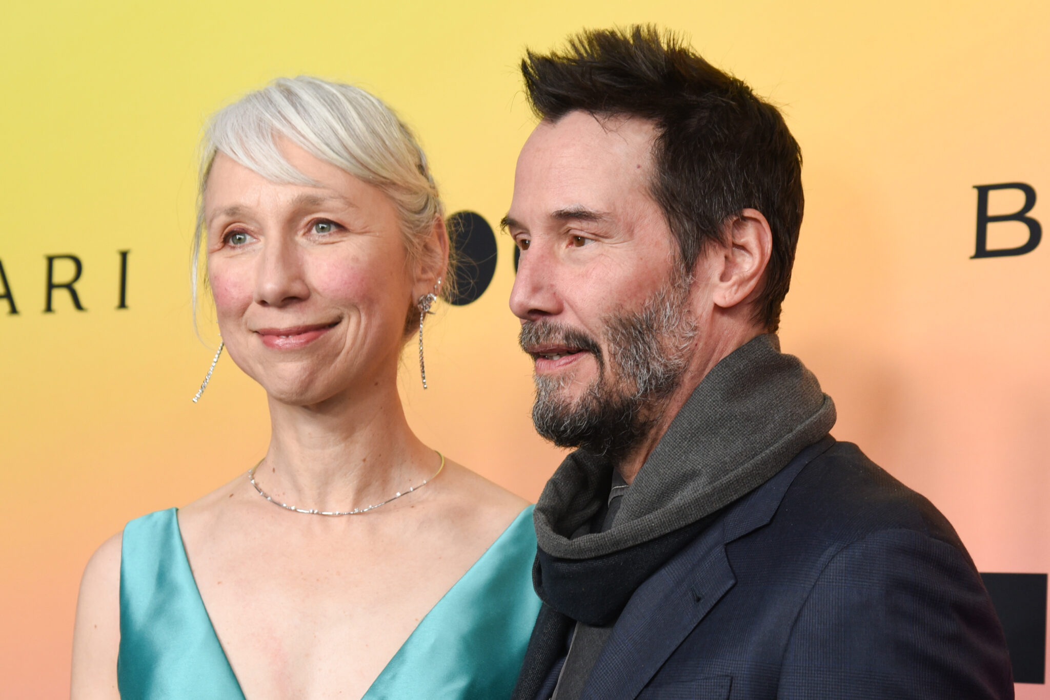 Keanu Reeves’ girlfriend, 54, faces mixed reactions after posing in teal cut-out dress on red carpet